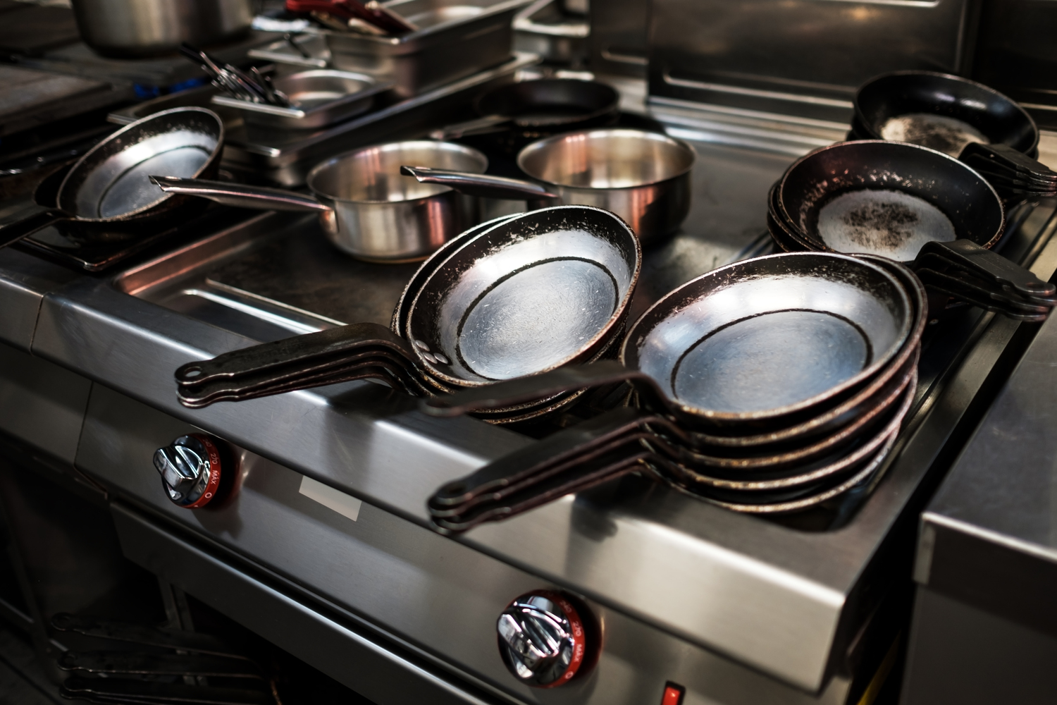 Metal black pans on restaurant kitchen